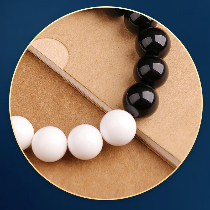 10 mm schwarzes Obsidian-Yin-Yang-Stärkearmband