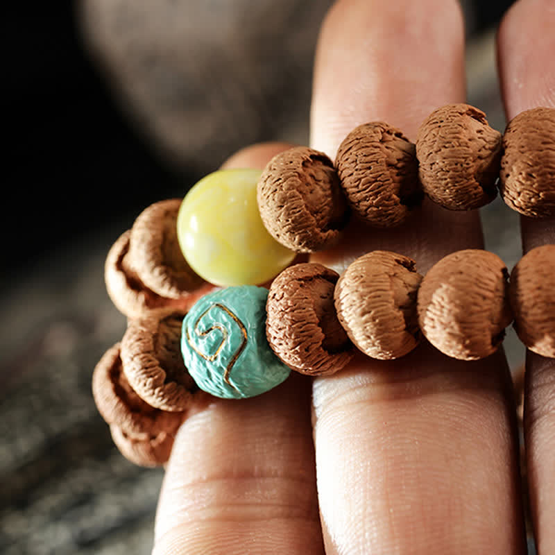 10 mm Bodhi-Samen-Schutzarmband aus Türkis und Bernstein