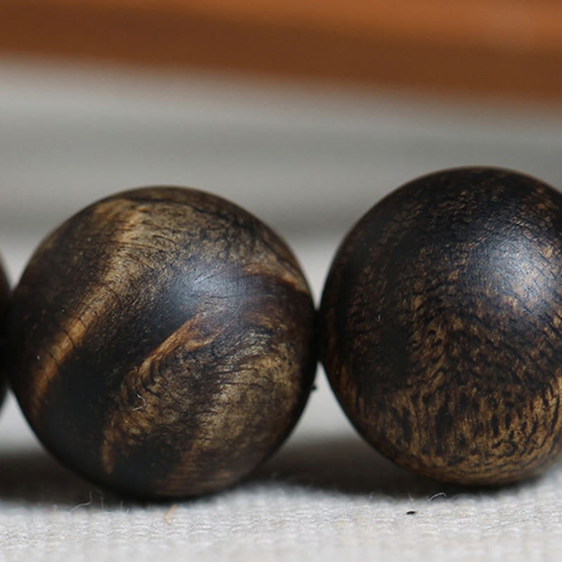 10 mm Brunei Agarwood Wasserwellen-Friedensarmband
