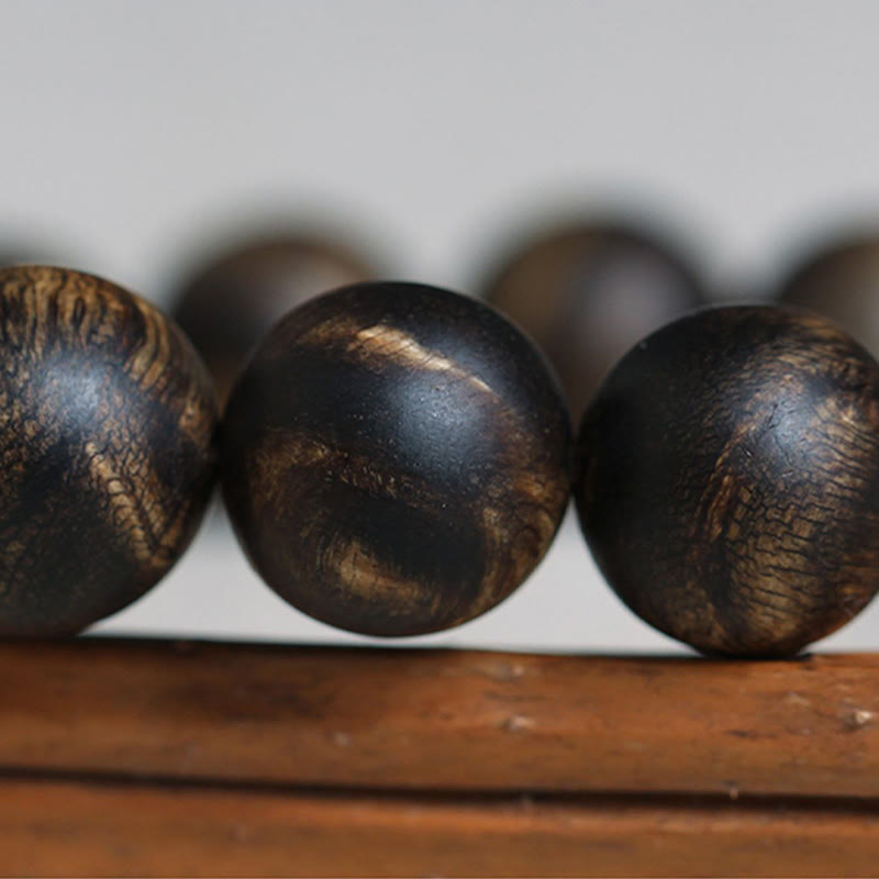 10 mm Brunei Agarwood Wasserwellen-Friedensarmband