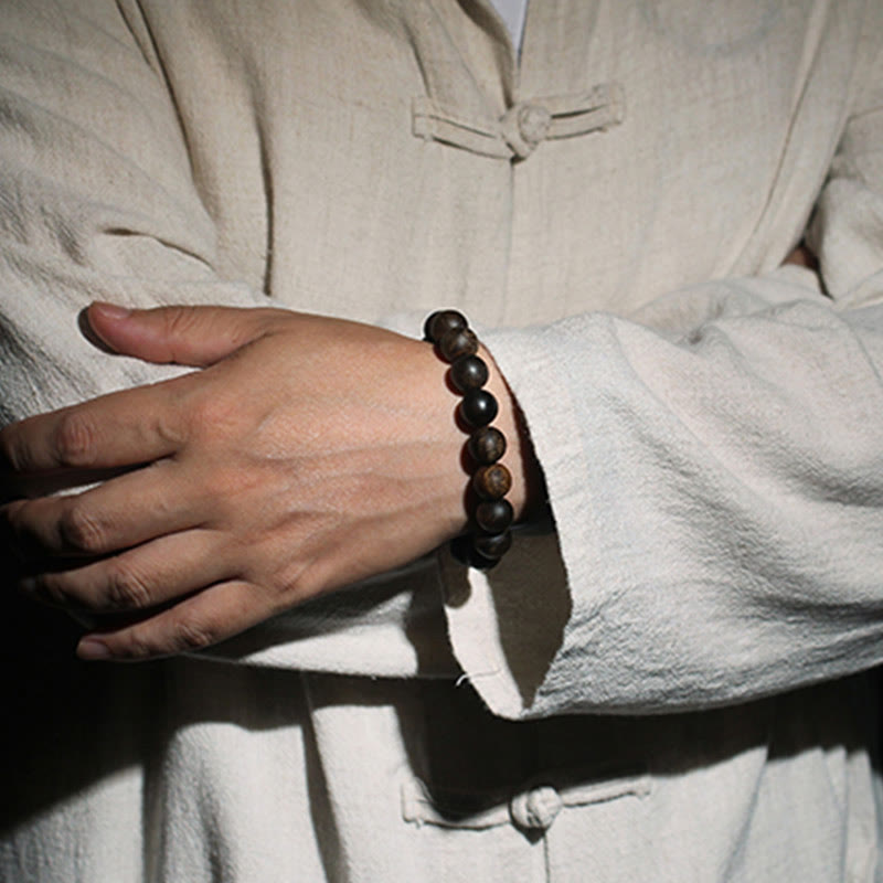 10 mm Brunei Agarwood Wasserwellen-Friedensarmband