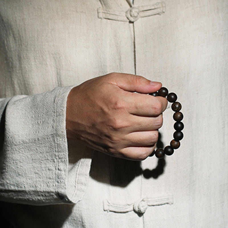 10 mm Brunei Agarwood Wasserwellen-Friedensarmband