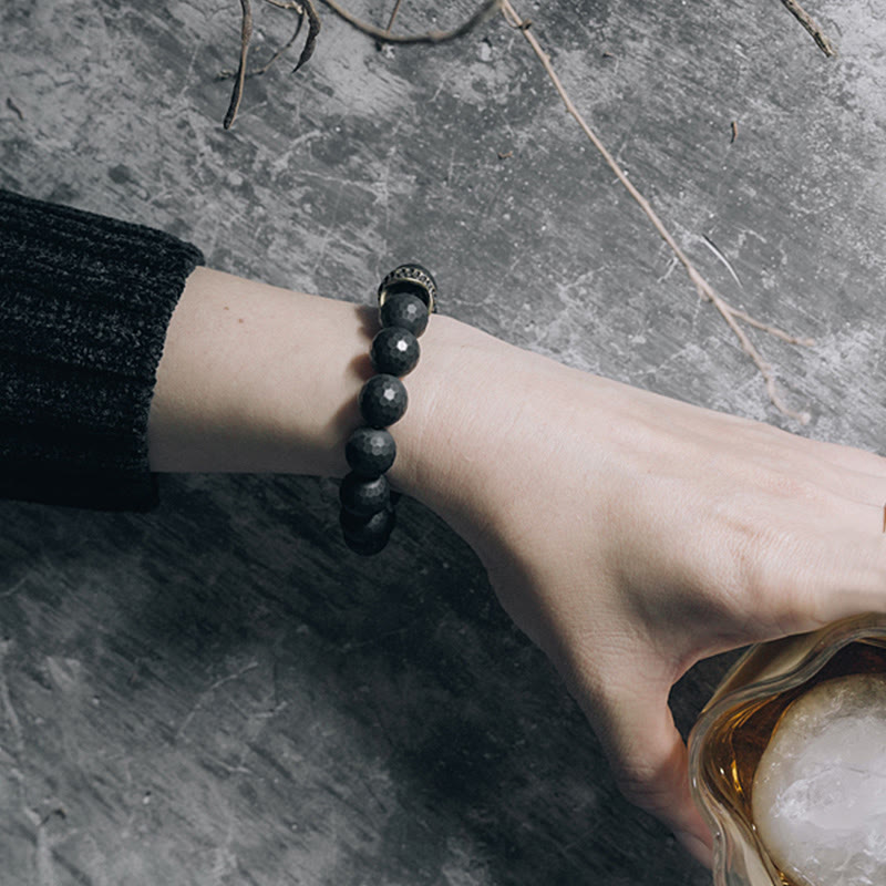 12 mm schwarzes Onyx-Schutzarmband mit Kupferakzent | Heilende Klänge