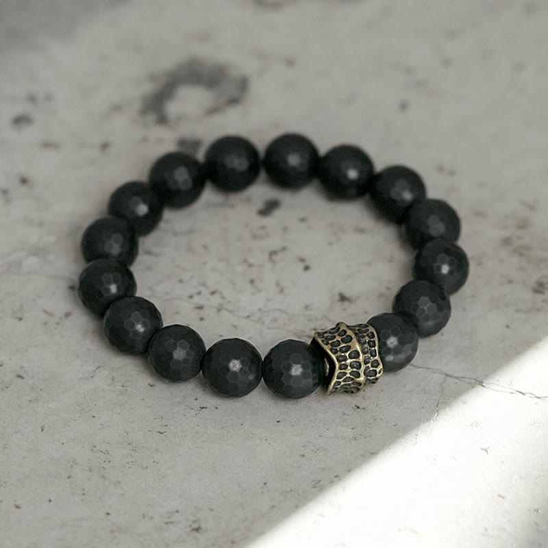 12 mm schwarzes Onyx-Schutzarmband mit Kupferakzent | Heilende Klänge