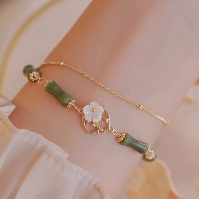 14 Karat vergoldetes spirituelles Peridot-Armband mit Bambusblüte