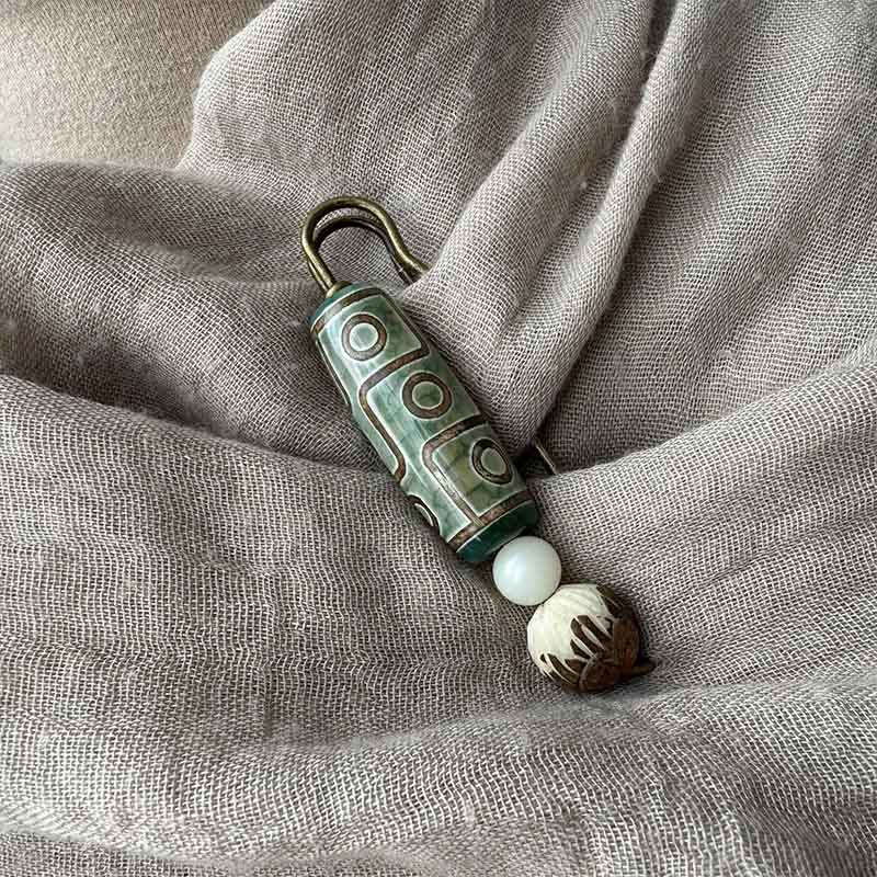 Neun-Augen-Dzi-Perle Bodhi-Samen Lotus Schutzbrosche