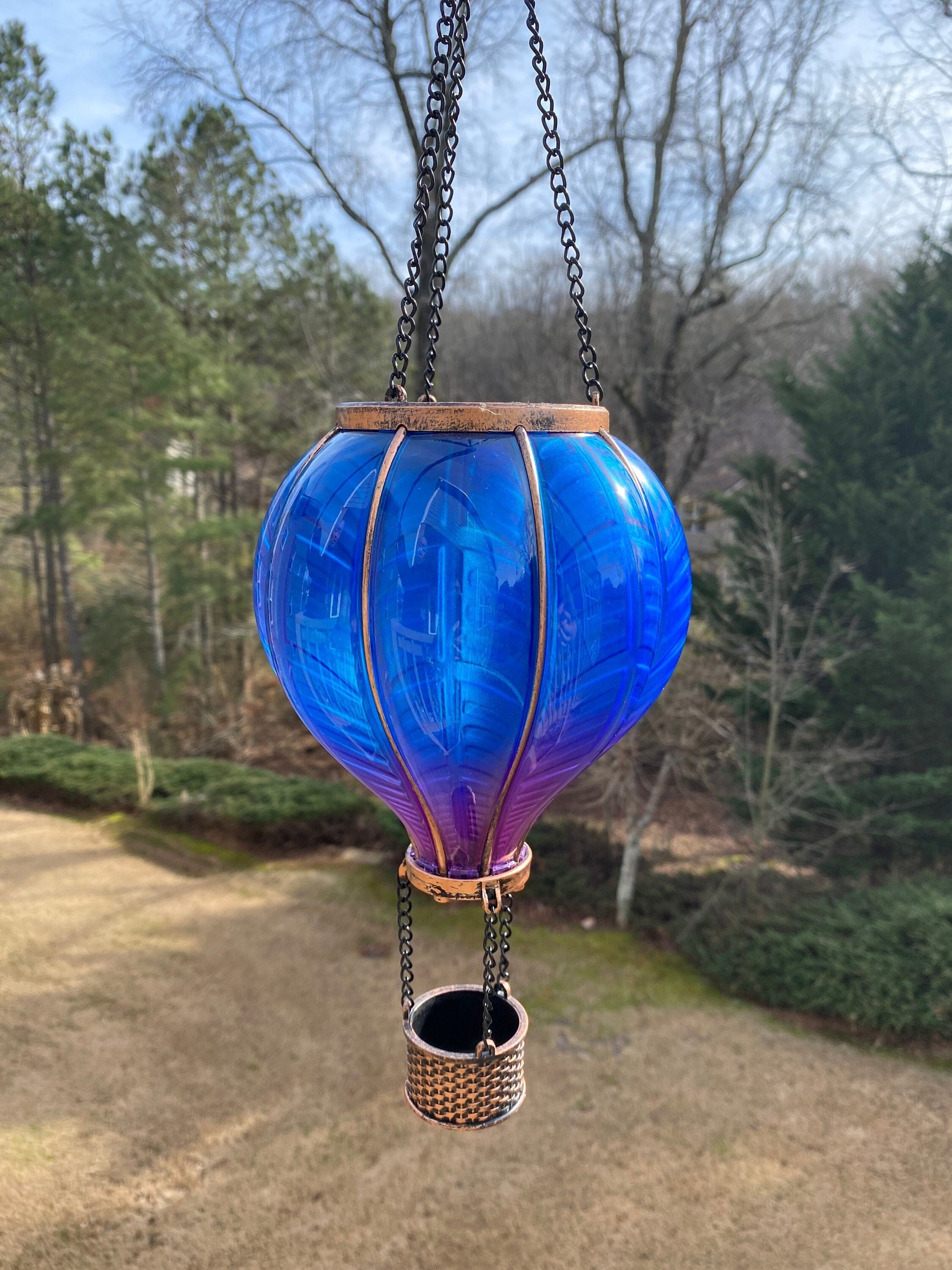 Decorative blue glass hot air balloon ornament with metallic accents for solar lantern