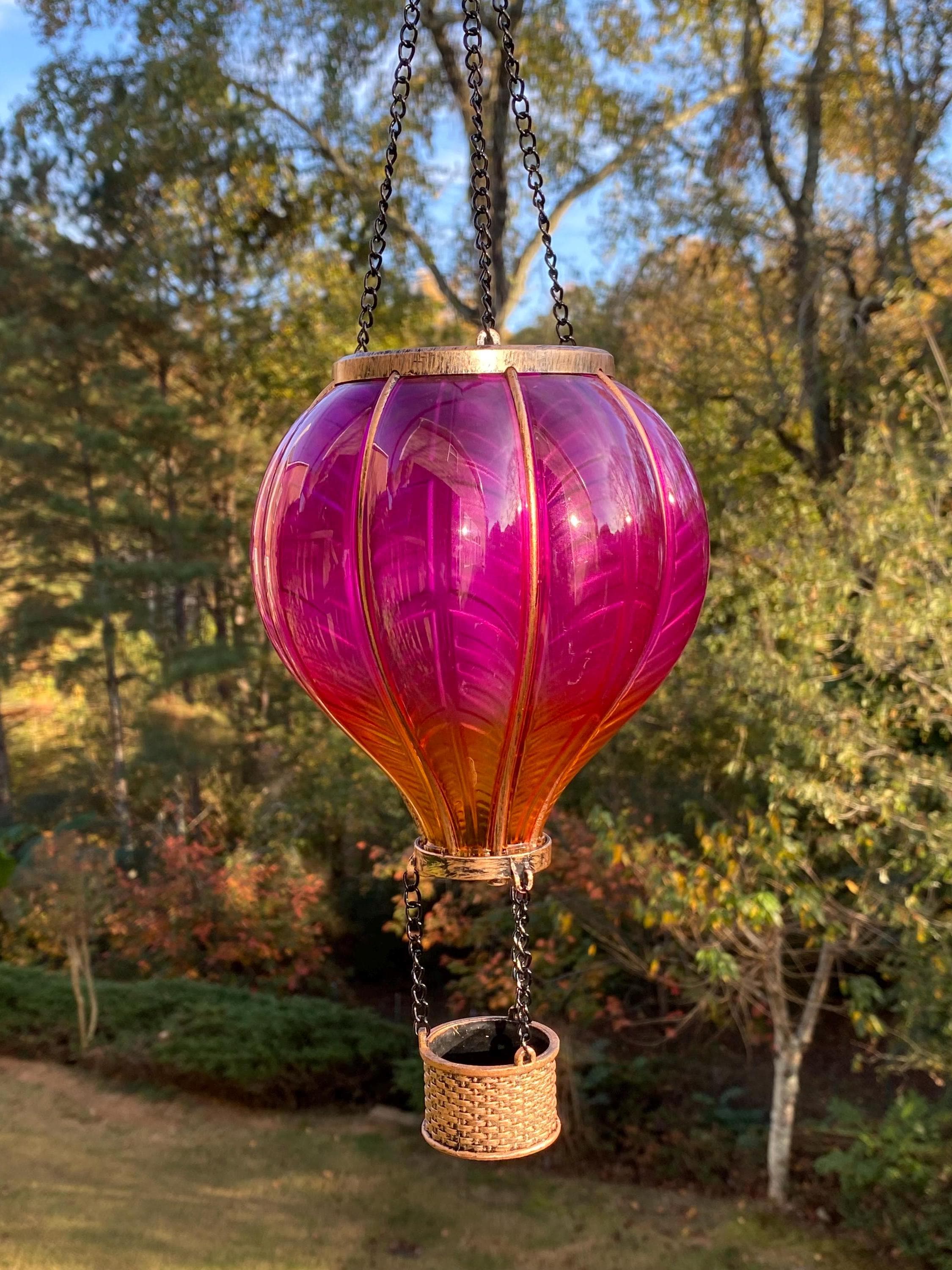 Vibrant pink and orange glass hot air balloon lantern for garden decor