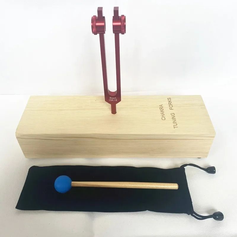 Red tuning fork with wooden base and blue mallet for 194.18 Hz Chakra Root Healing