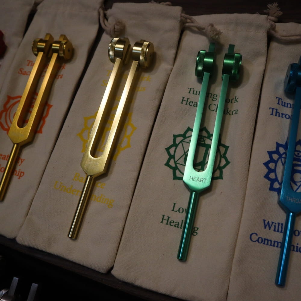 Metallic tuning forks in gold, silver, and green from 23pc Human Biology & Chakra Set