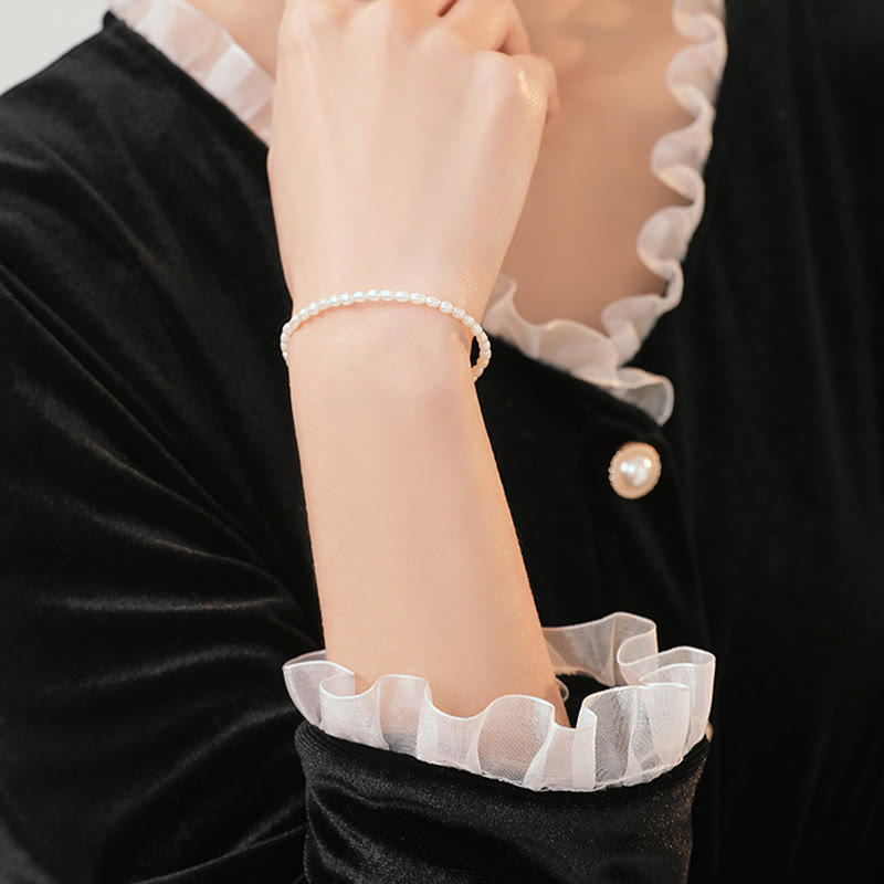 2 mm Naturperle &amp; 14 Karat vergoldetes Weisheitsarmband