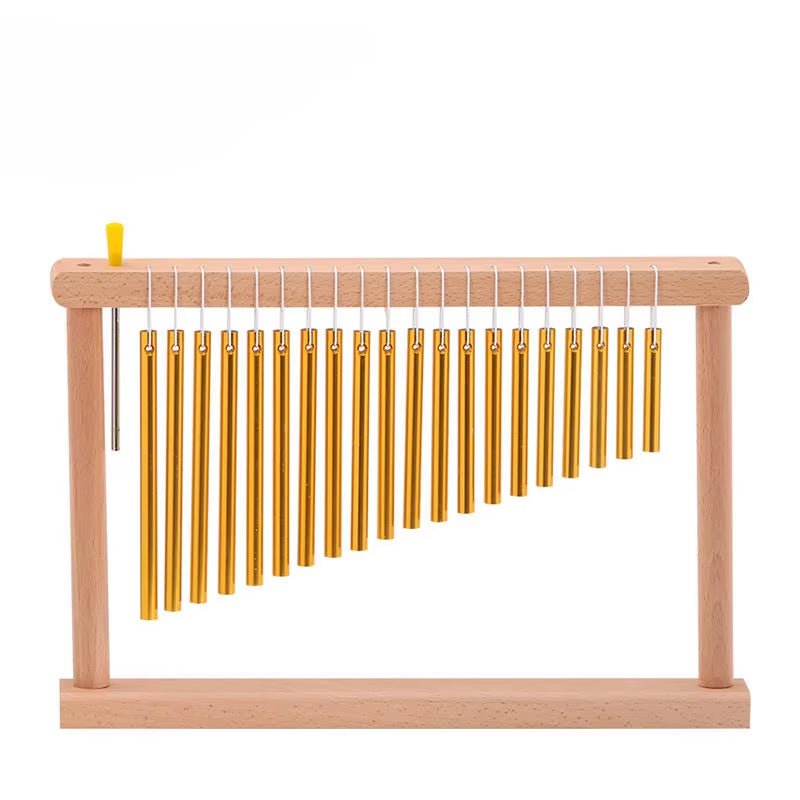 Golden chimes on a wooden frame for 36-Tone Yoga and Meditation relaxation