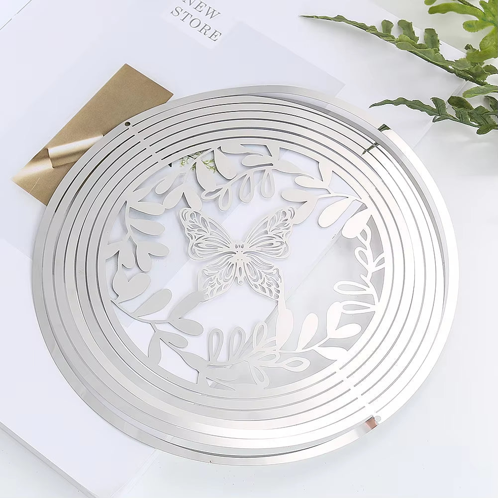 Circular silver plate featuring etched butterfly and leaf design for outdoor decor