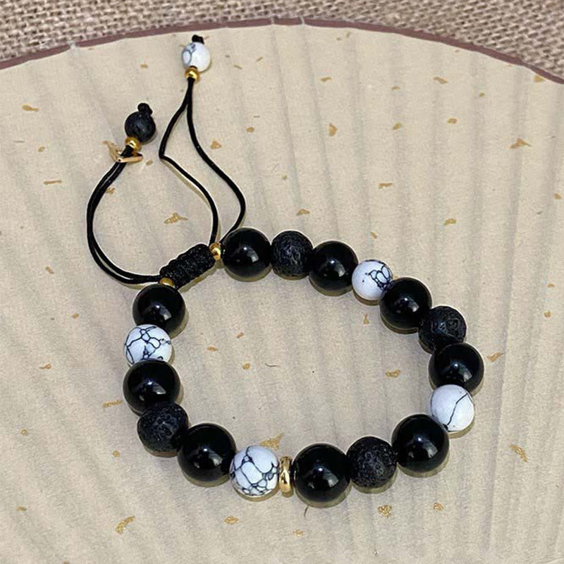 Schwarzes Obsidian-Lavastein-Yin-Yang-Armband für Stärke
