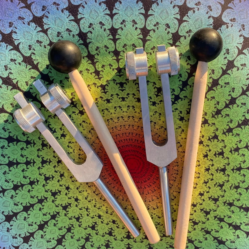 Three 432 Hz and 528 Hz Solfeggio Tuning Forks with wooden handles and rubber tips