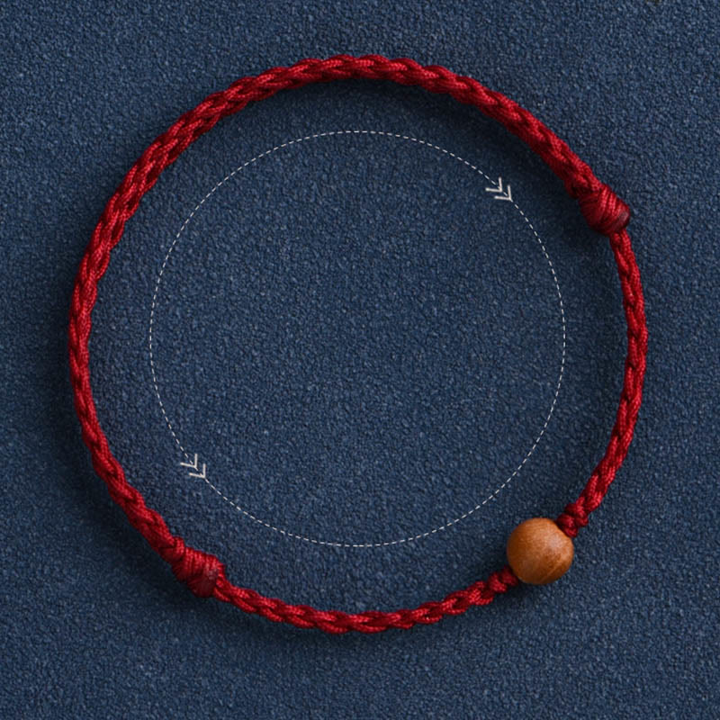 6 mm Schutzarmband aus Pfirsichholz mit roter Schnur