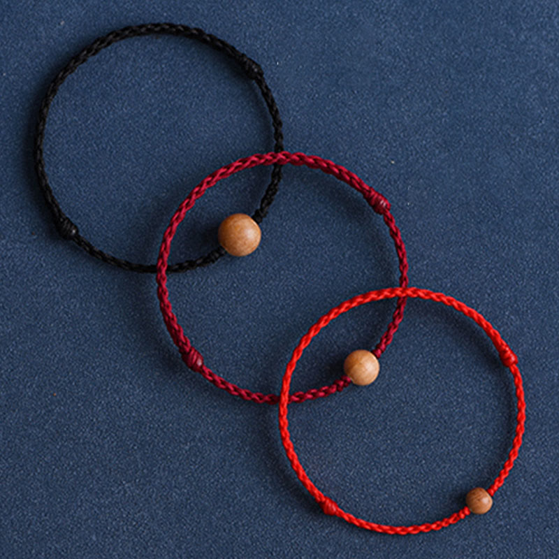 6 mm Schutzarmband aus Pfirsichholz mit roter Schnur