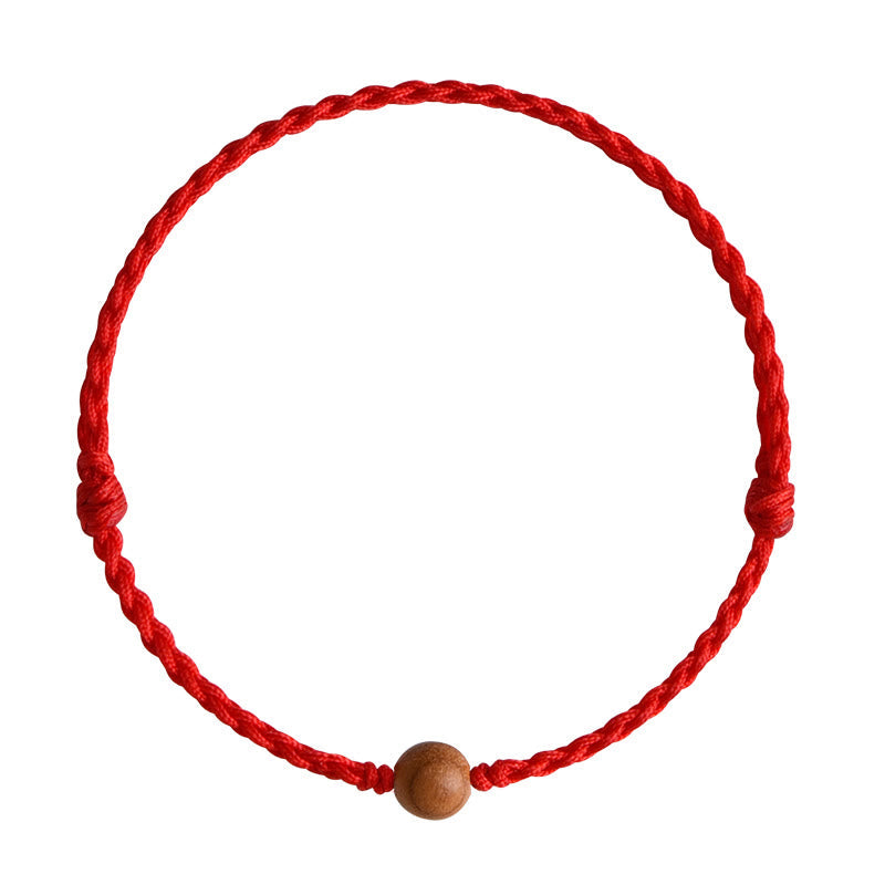 6 mm Schutzarmband aus Pfirsichholz mit roter Schnur
