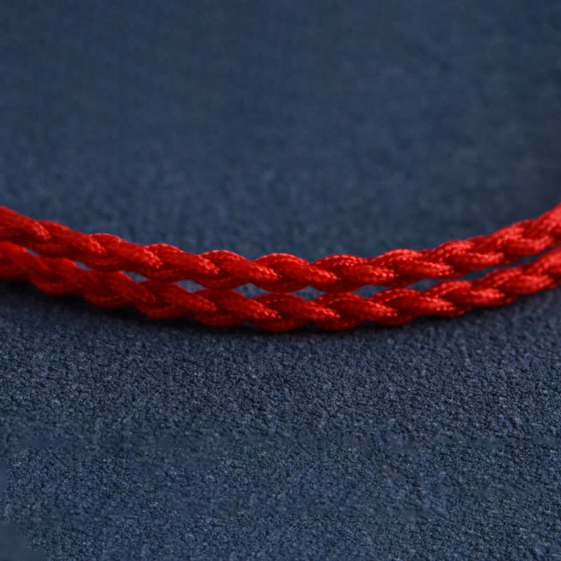 6 mm Schutzarmband aus Pfirsichholz mit roter Schnur