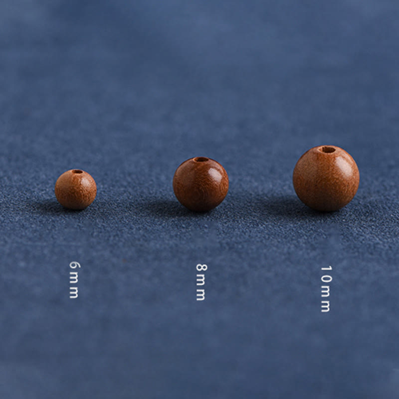 6 mm Schutzarmband aus Pfirsichholz mit roter Schnur