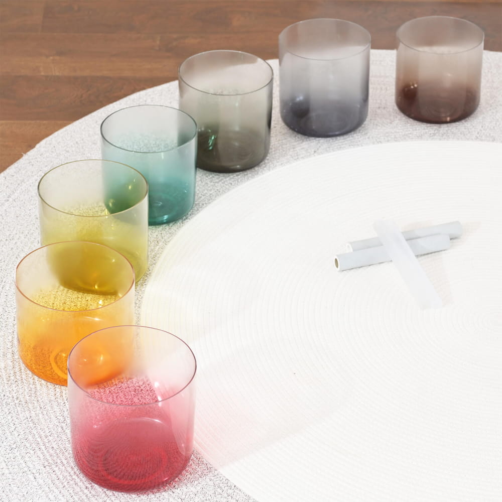 Colorful gradient drinking glasses in a curve from pink to brown for Alchemy Aria Set