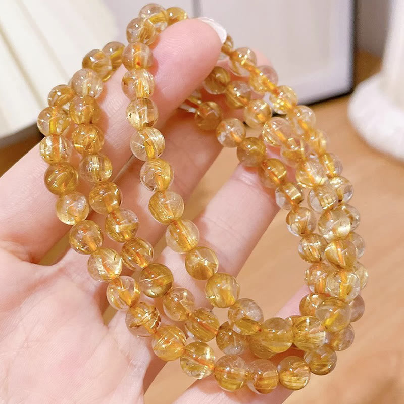 7 mm großes Reichtumsarmband aus goldenem Rutilquarz mit Sonnenstein und Kyanit