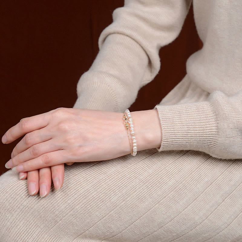 Heilarmband aus 925er Sterlingsilber mit 14 Karat vergoldeter Perle