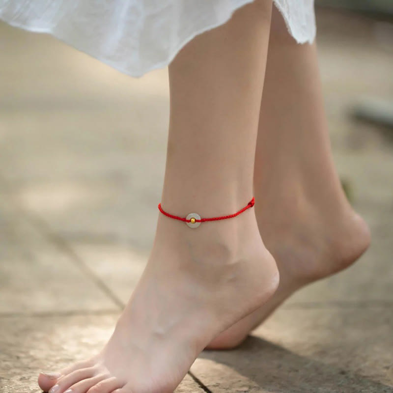 Glücksarmband aus 999er Goldperlen aus Hetian-Jade mit Friedensschnalle