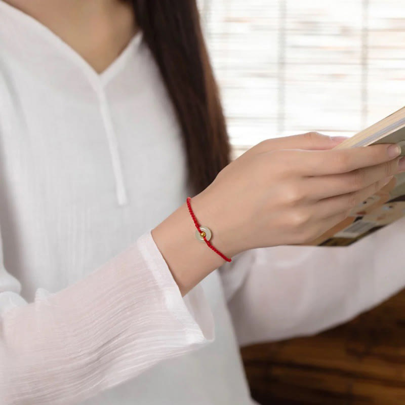 Glücksarmband aus 999er Goldperlen aus Hetian-Jade mit Friedensschnalle