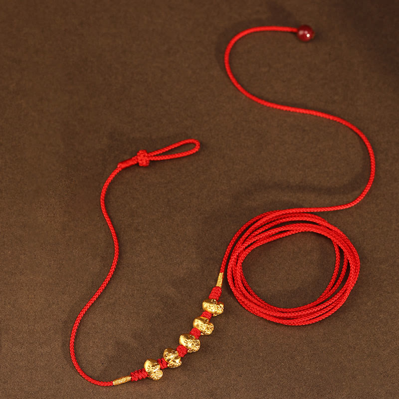 Bauchkette aus 999er Gold mit roter Schlangenschnur für Schutz und Wohlstand