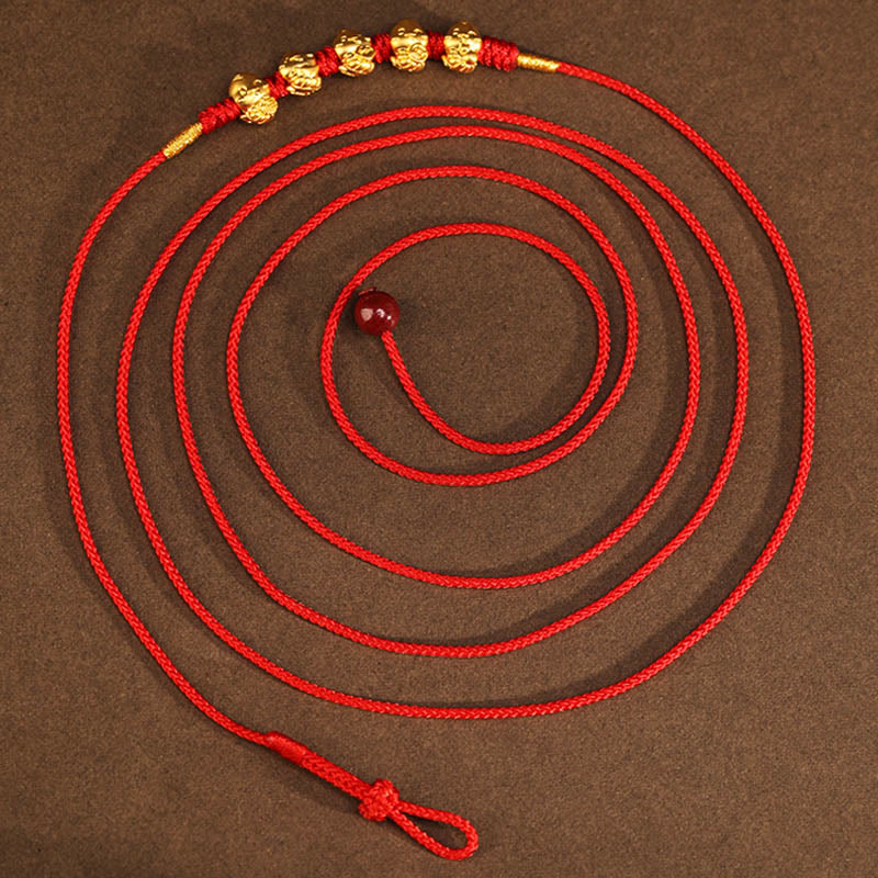 Bauchkette aus 999er Gold mit roter Schlangenschnur für Schutz und Wohlstand