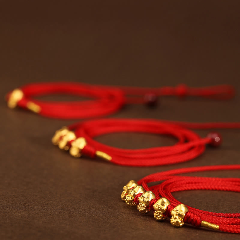 Bauchkette aus 999er Gold mit roter Schlangenschnur für Schutz und Wohlstand