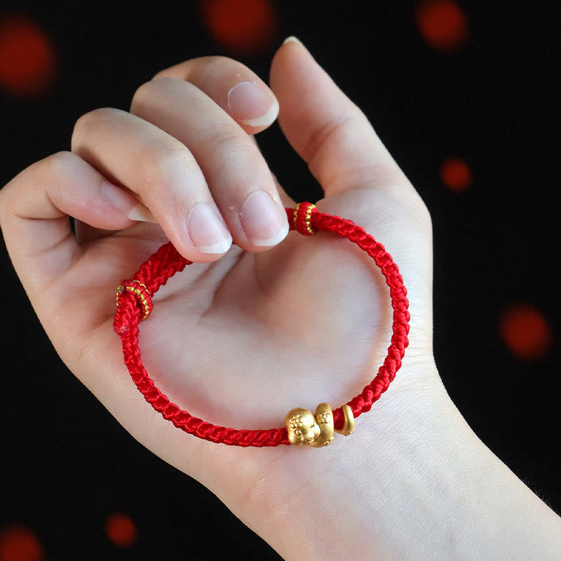 Glücksarmband aus 999 Sterlingsilber mit roter Schlangenschnur