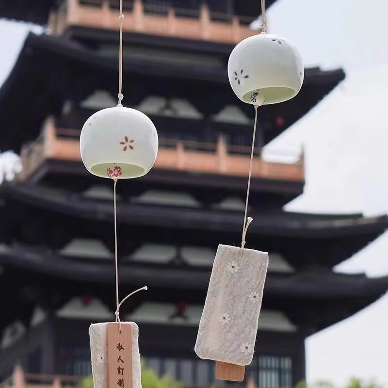 Japanese wind chimes with ceramic bells and paper tags for outdoor decor