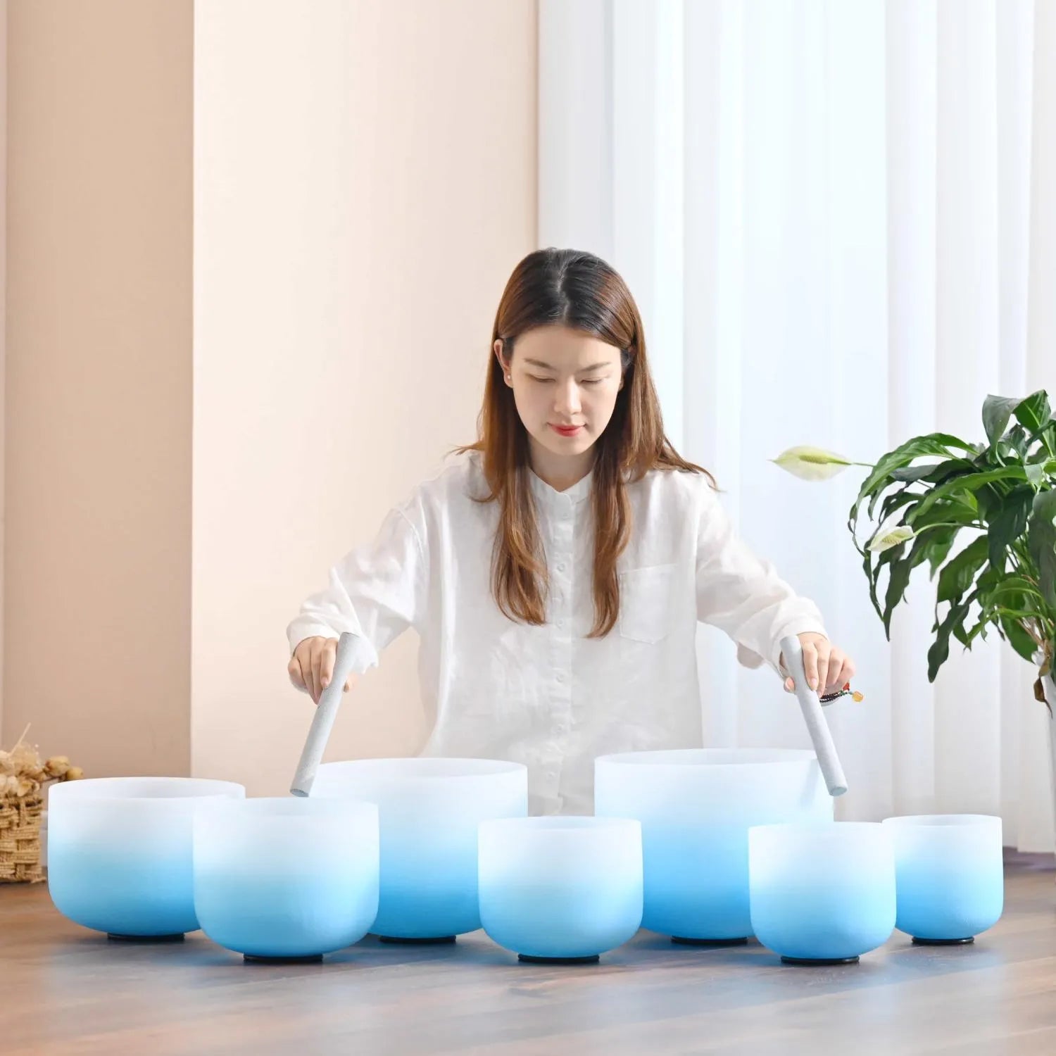 Blue Aria Gradient Chakra Crystal Singing Bowls featuring blue ombré coloring