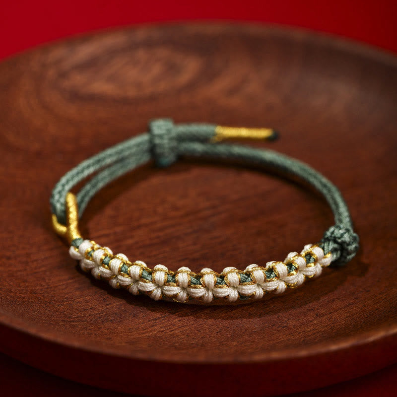 Verstellbares Armband aus rotem tibetischem Goldfaden mit Pfirsichblütenknoten