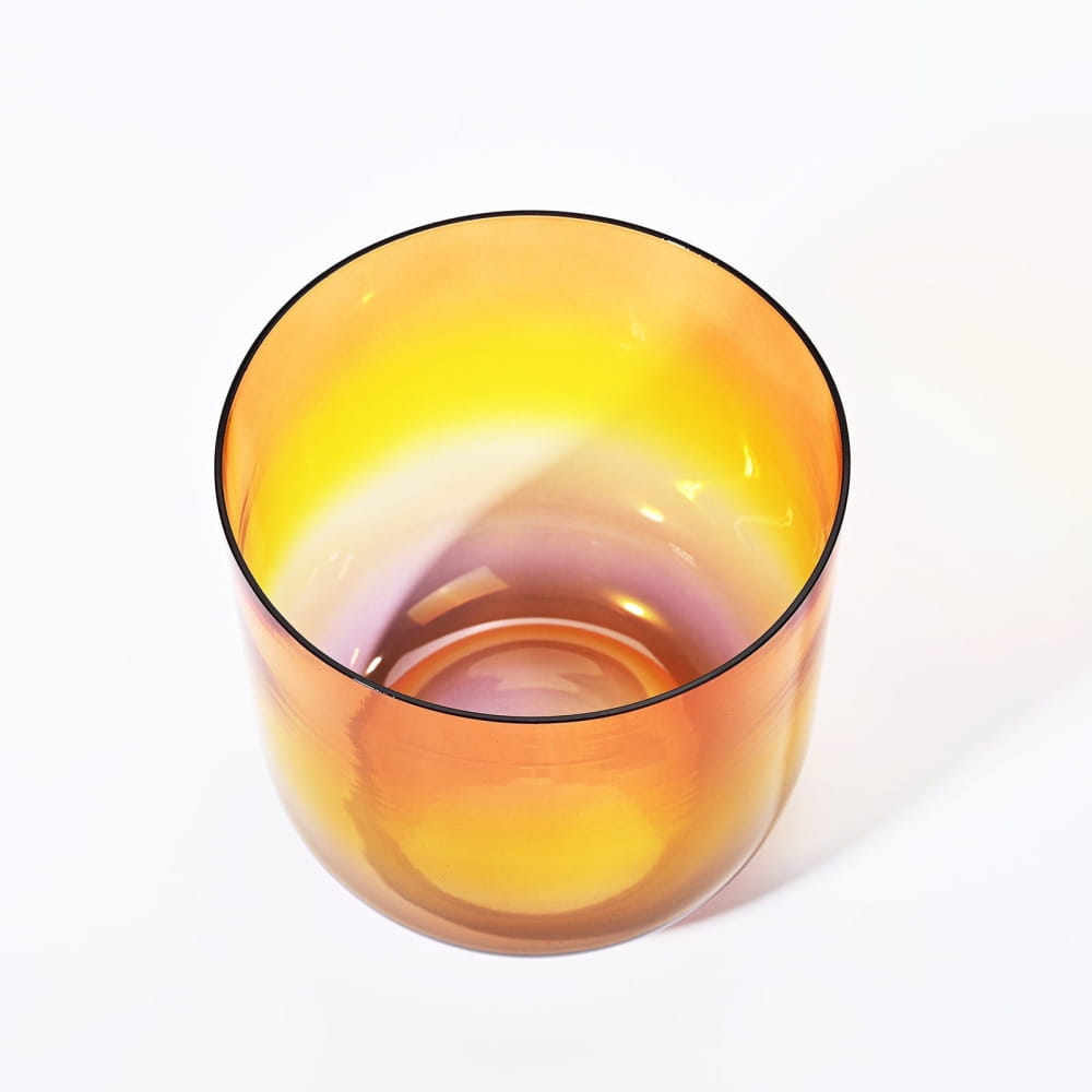 Amber-colored cylindrical glass tumbler for Alchemy Clear Rainbow D Note Crystal Singing Bowl