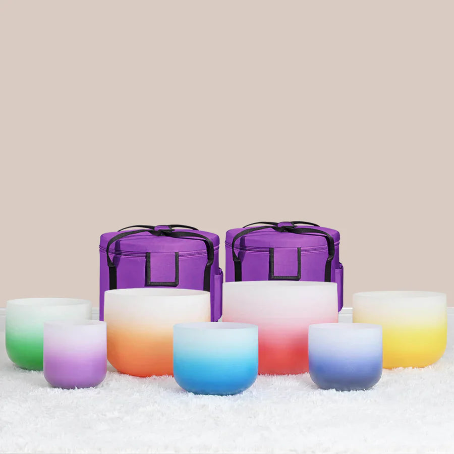 Colorful gradient frosted glass candle holders with purple containers behind Aria set