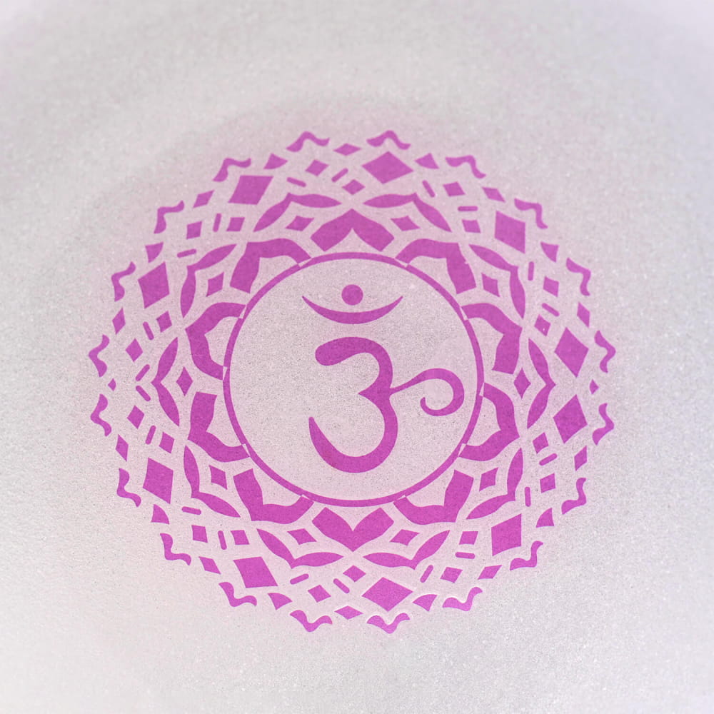 Pink Om symbol with mandala pattern on B Note Crystal Singing Bowl for Crown Chakra