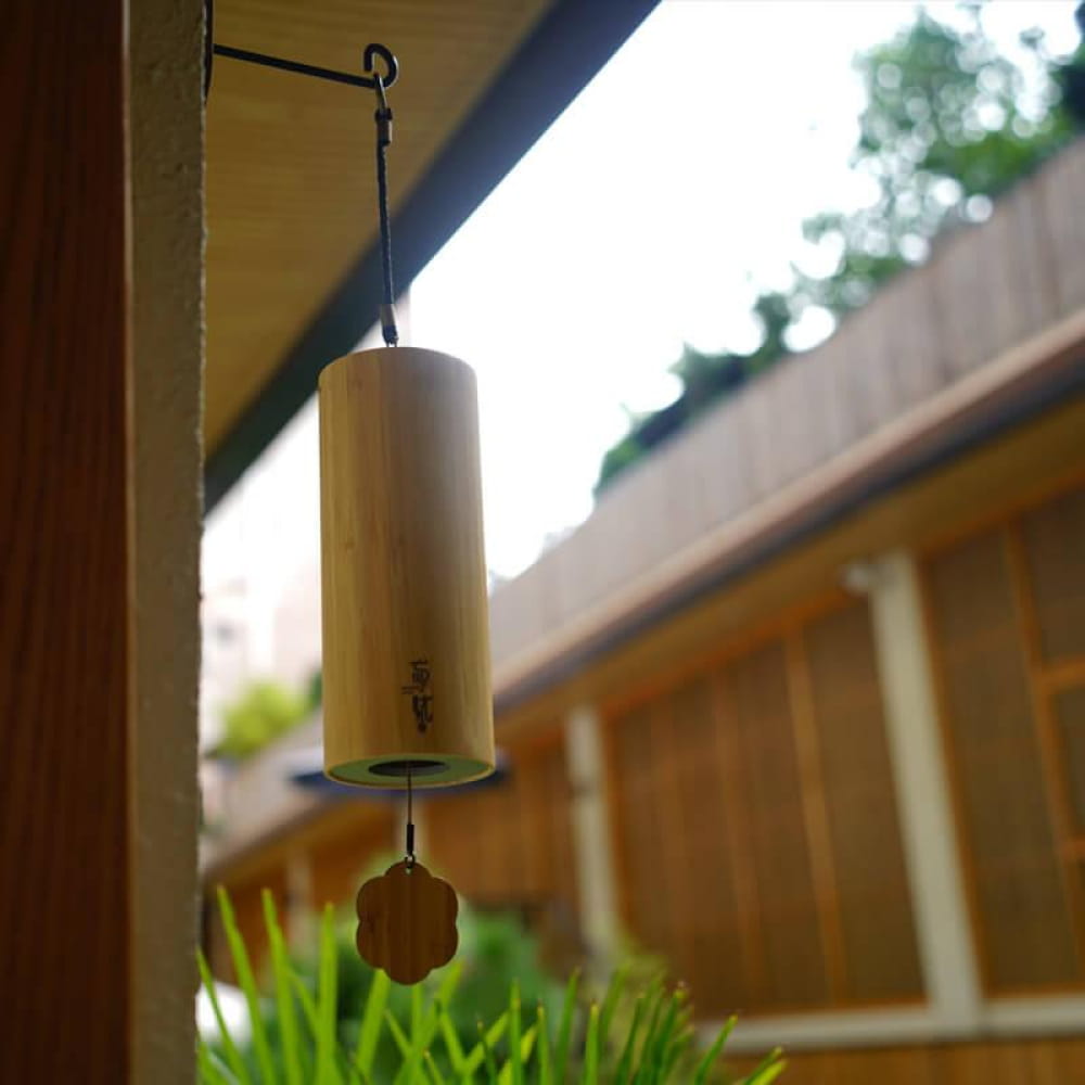 Cylindrical Bamboo 9-Tone Wind Chime with decorative hanging element at the bottom