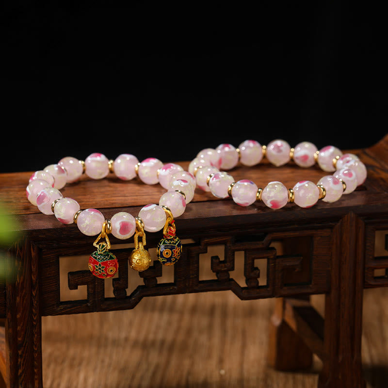 Luminous Pink Love Heart Spiritual Bracelet with Gold Swallowing Beast