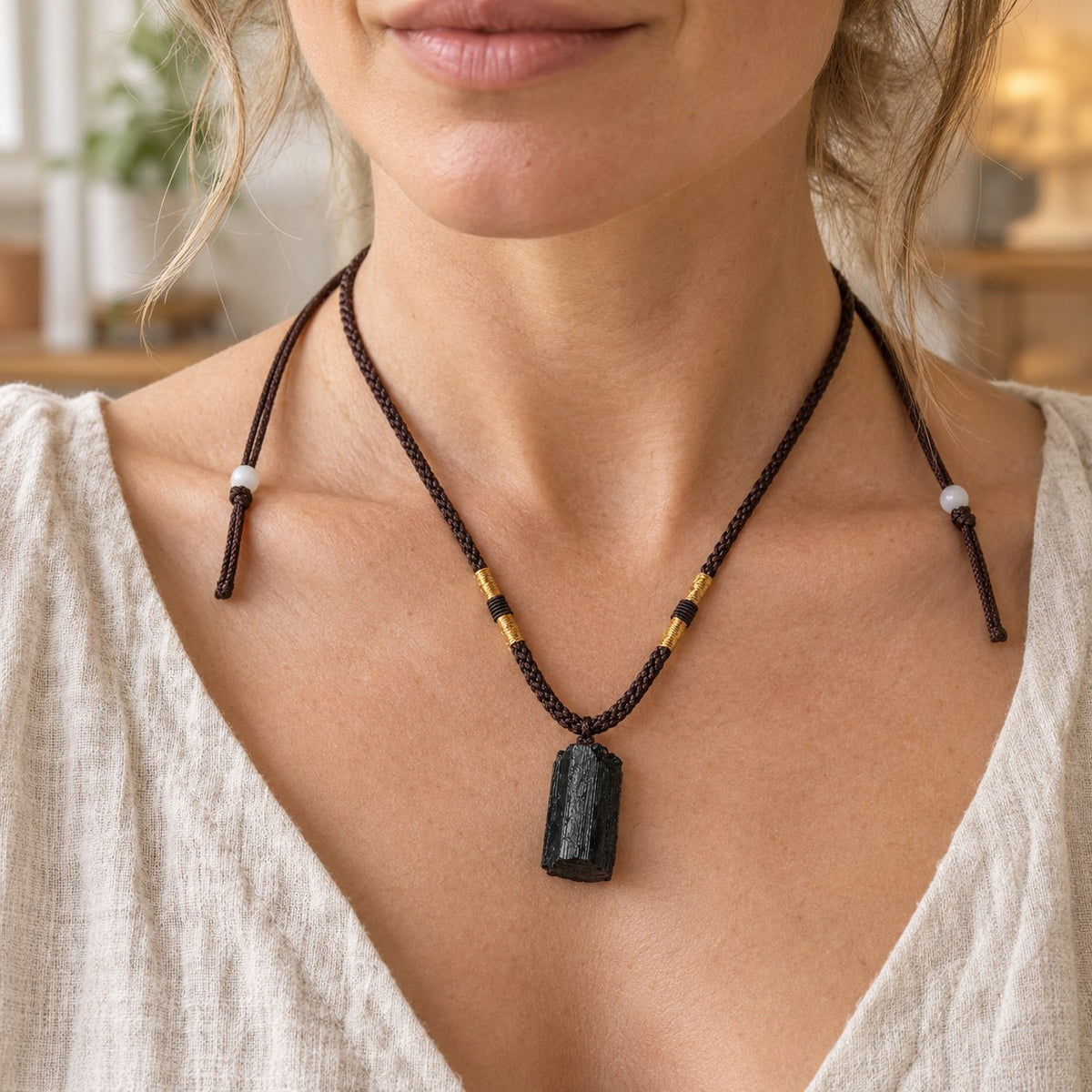 Black Tourmaline Spiritual Necklace with Positive Energy Pendant, worn on the neck by a man
