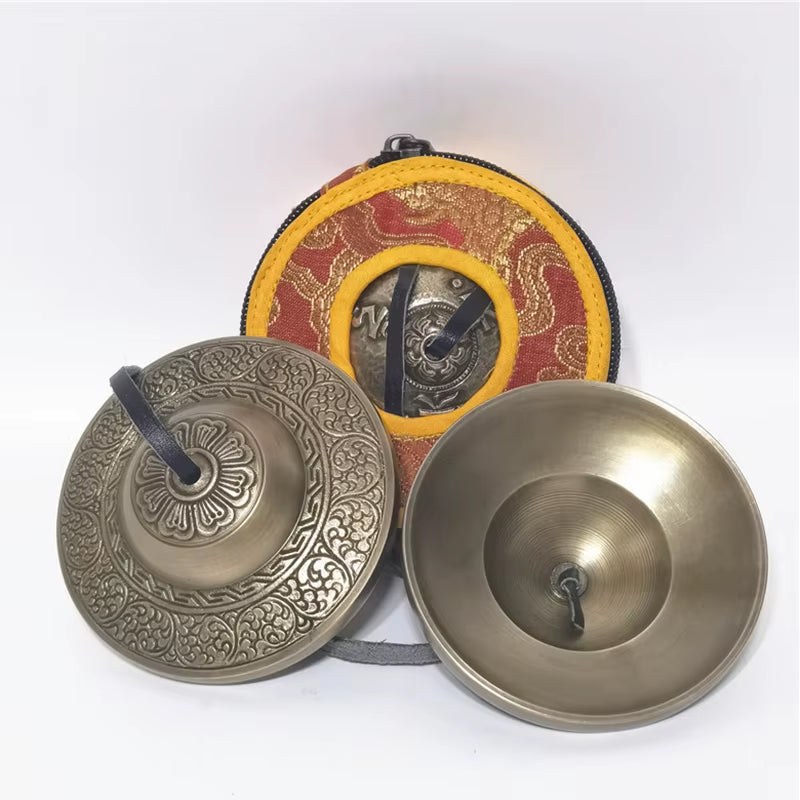 Brass Tingsha Cymbals for Meditation featuring ornate Tibetan patterns and designs