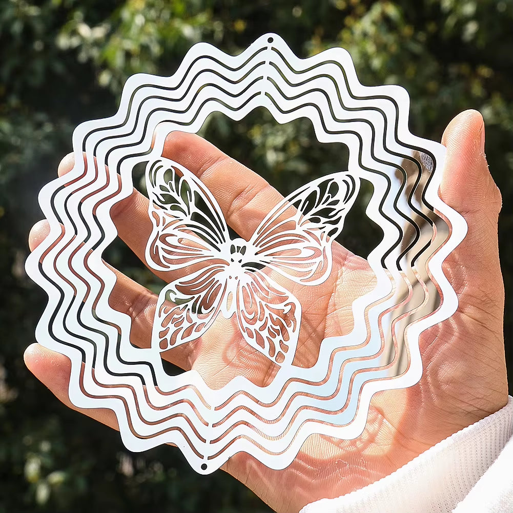 Delicate white paper-cut butterfly design with circular border on a metal wind spinner