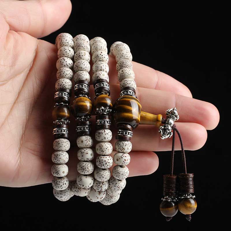108 Perlen Tigerauge Bodhi Seed Armband 7x9mm Peace