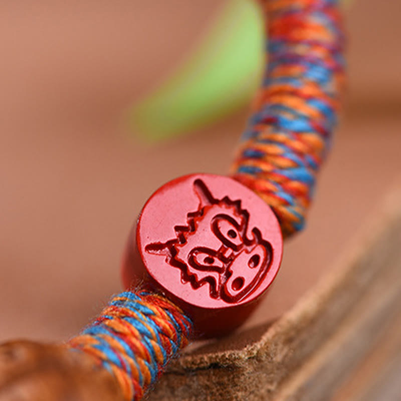 Chinesisches Sternzeichen-Armband mit roter Schnur, Pfirsichkern, Zinnober, Glücksbringer