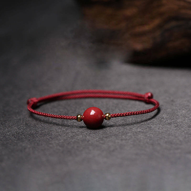 Zinnoberarmband und Fußkettchen mit Glücksbringerschnur