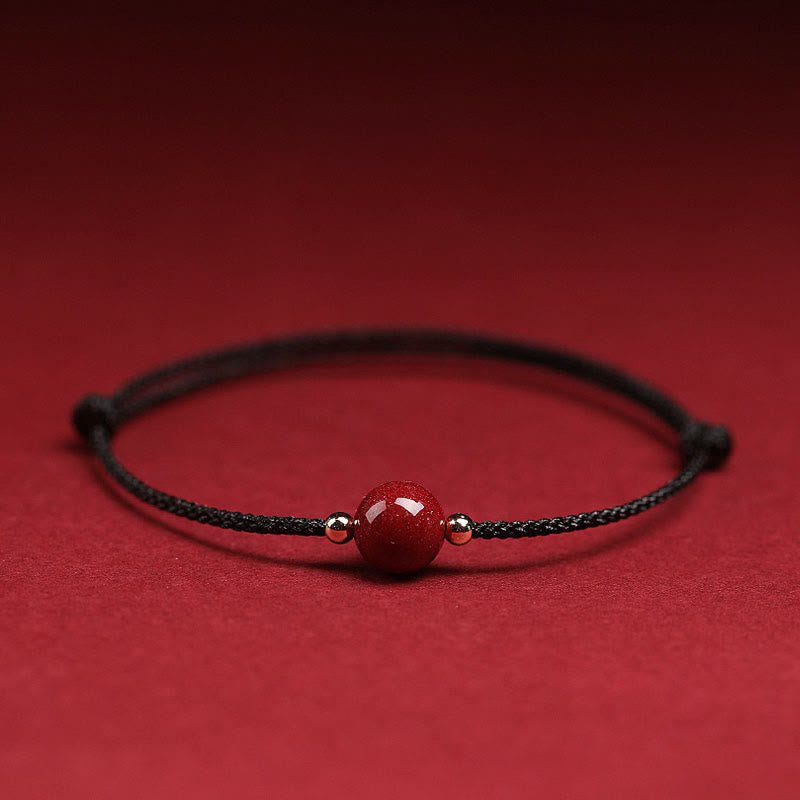 Zinnoberarmband und Fußkettchen mit Glücksbringerschnur