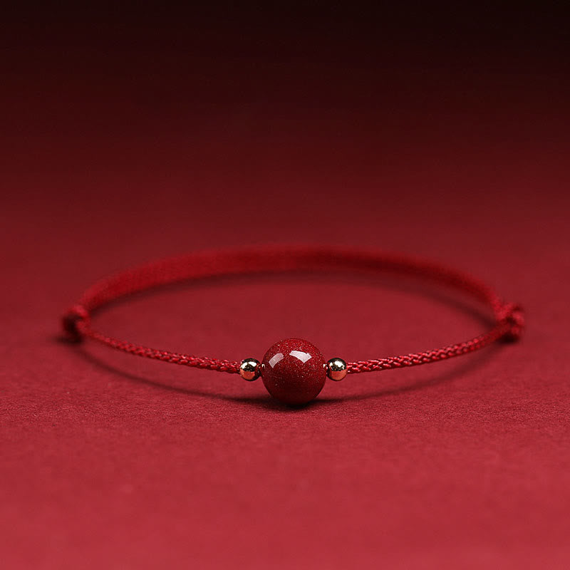Zinnoberarmband und Fußkettchen mit Glücksbringerschnur