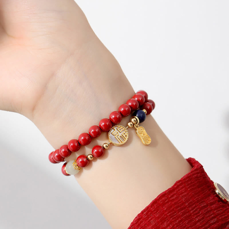 Zinnoberarmband mit Fu-Charakter und Tridacna-Stein